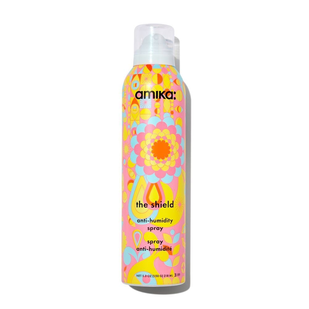 Amika anti-humidity spray bottle with colorful label on a white background